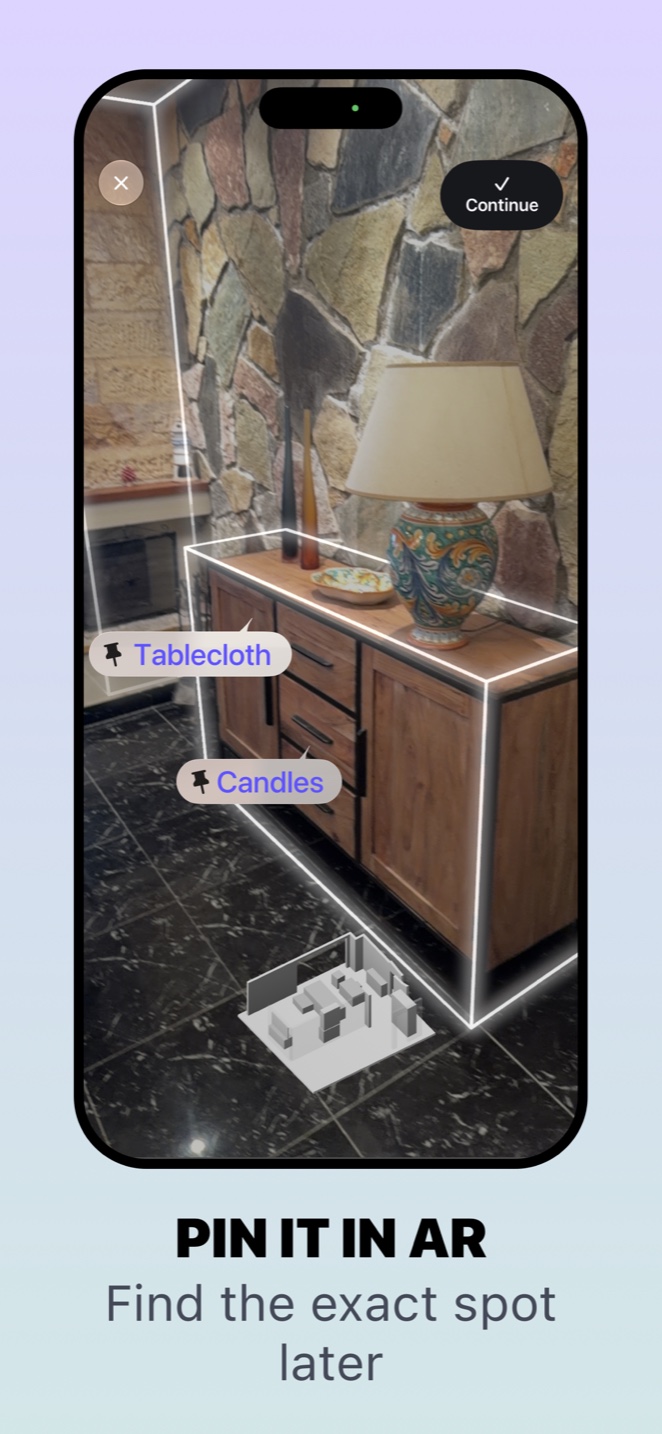 Whery on iPhone: a sideboard outlined in augmented reality with pinned things
